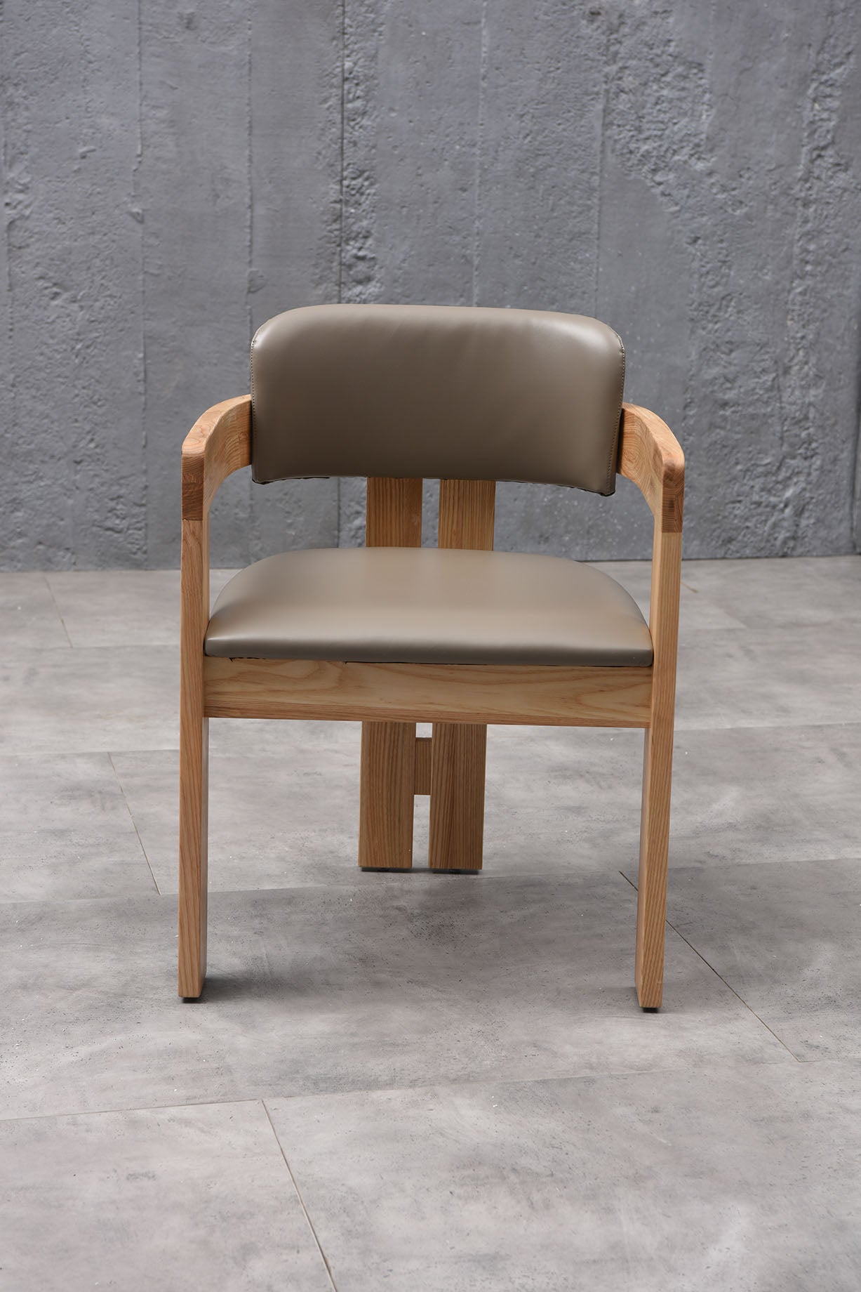 A luxurious solid wood upholstered dining chair