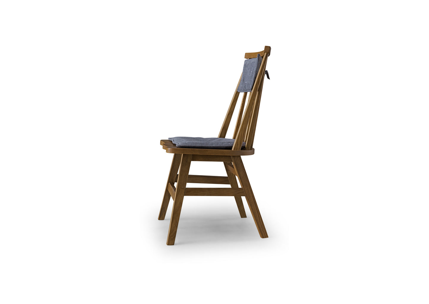 A minimalist soft backed solid wood dining chair