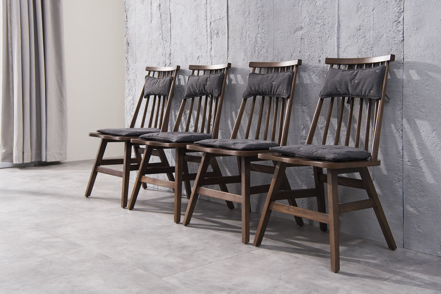 A minimalist soft backed solid wood dining chair