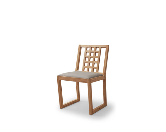 A minimalist hollowed out armless dining chair