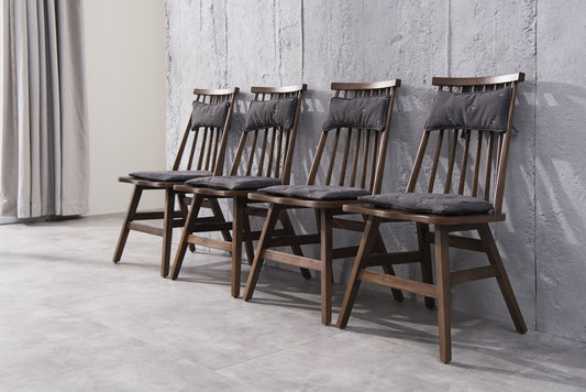 A minimalist soft backed solid wood dining chair