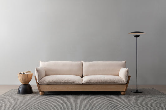 A sofa that combines natural fabric and solid wood